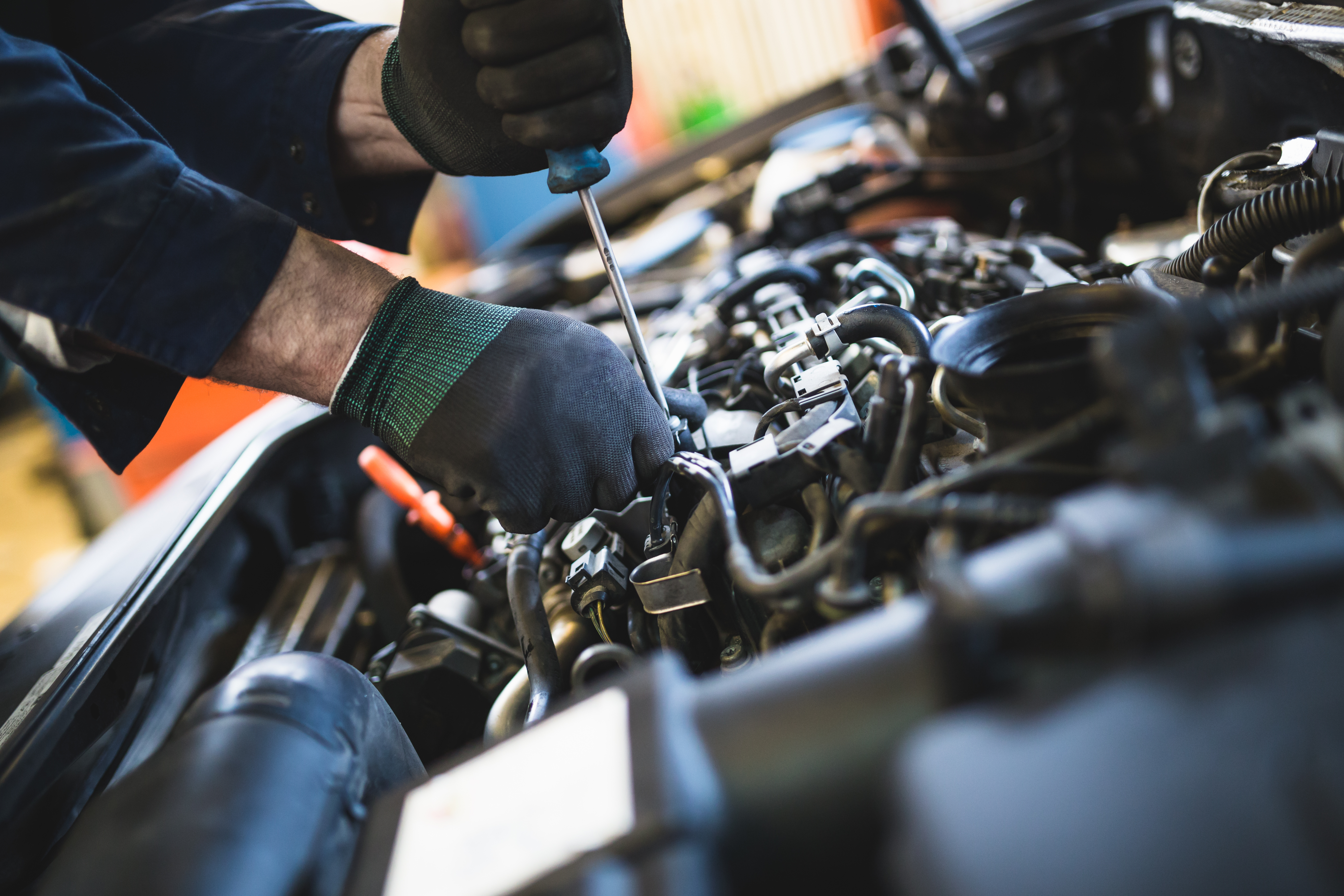 Mechanic Checking Oil